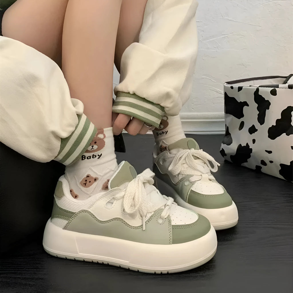 Green women's casual shoes with round toe and flat heel, made from breathable PU mesh.