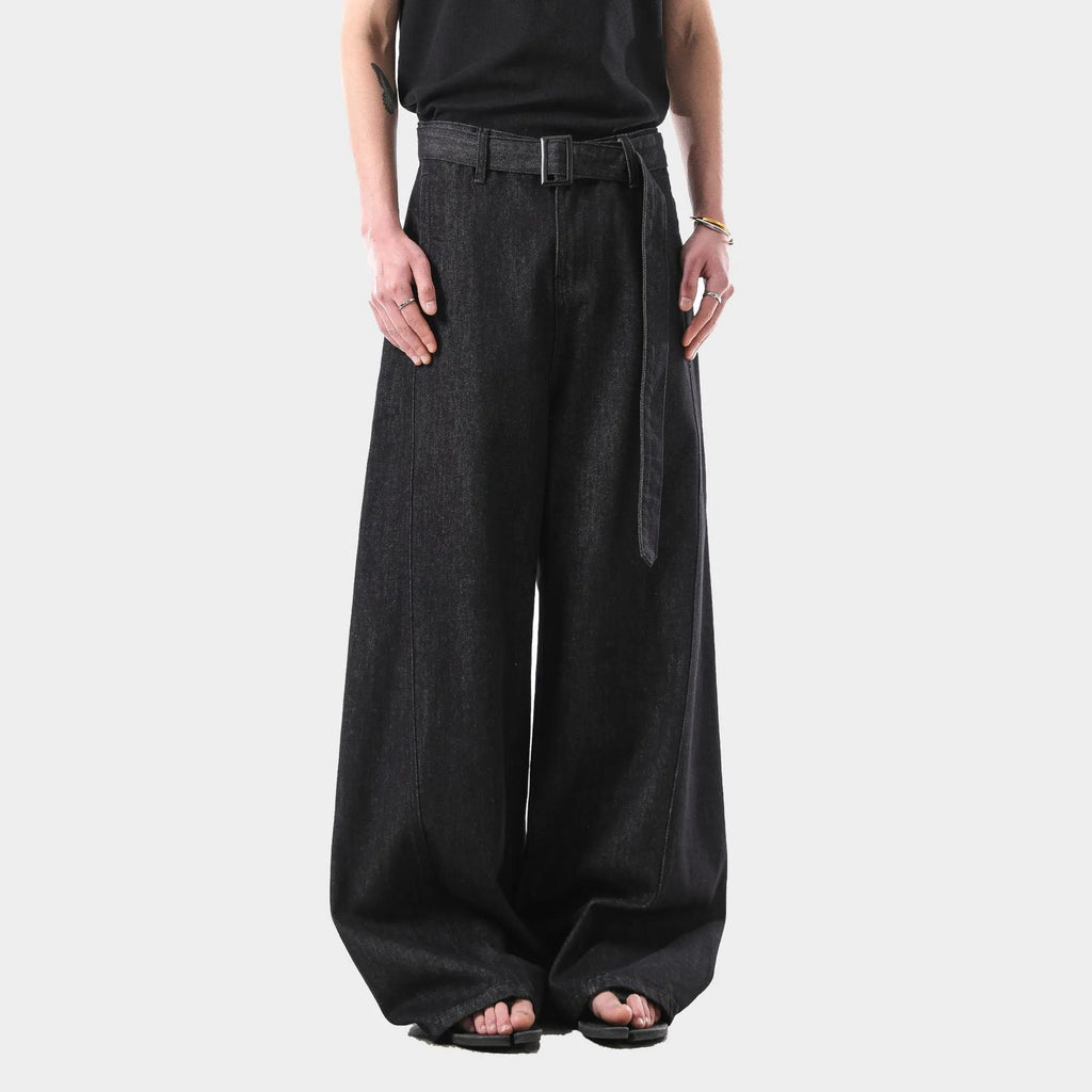 Women's high-waist straight-leg jeans in a black gold wash denim, showing front zip and five-pocket design.