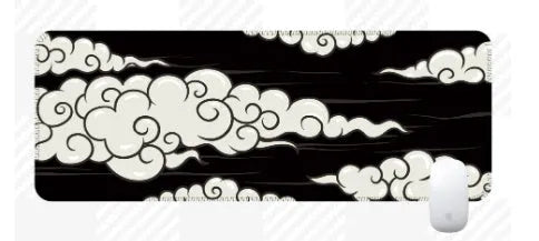 Large rectangular cloud pattern desk mat made of natural rubber on a wooden desk.