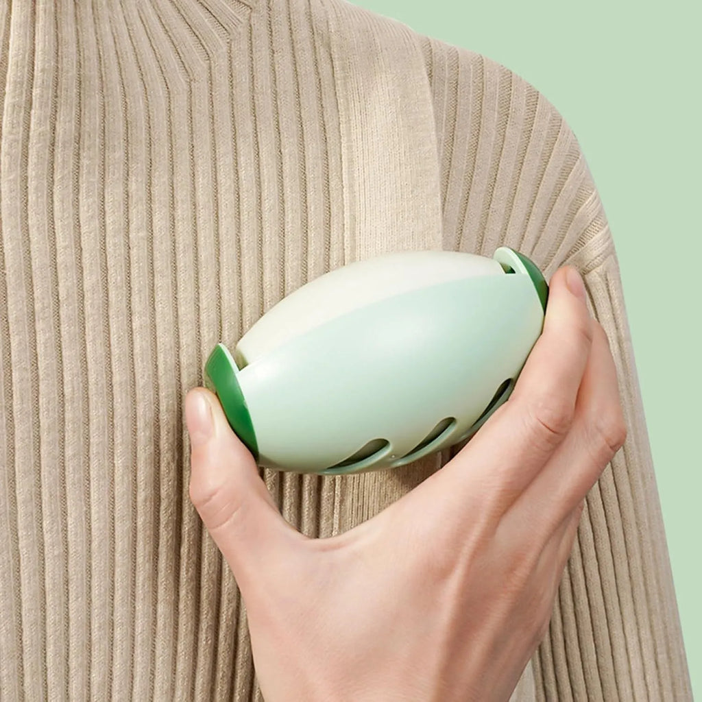 Green washable gel lint roller ball for pet hair removal on fabric