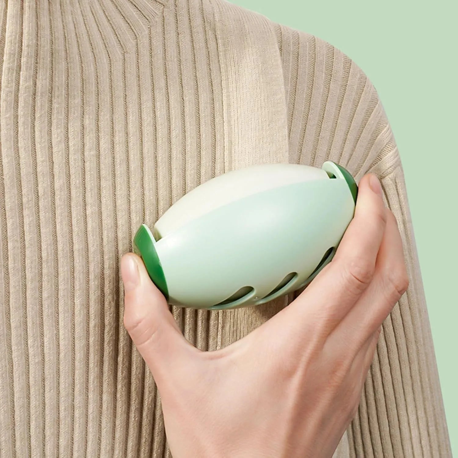 Green washable gel lint roller ball for pet hair removal on fabric