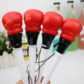 Set of four black ejection pens with a pressure relief boxing press button on the barrel.