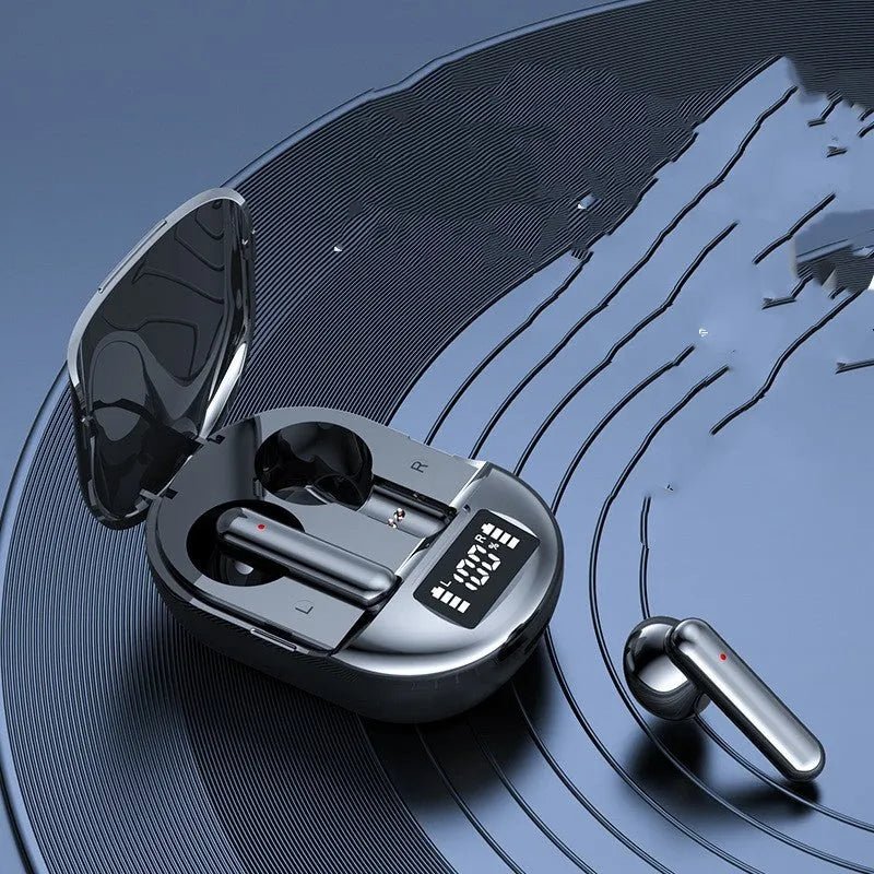 Black and white wireless Bluetooth in-ear headset with charging bin showing digital display screen