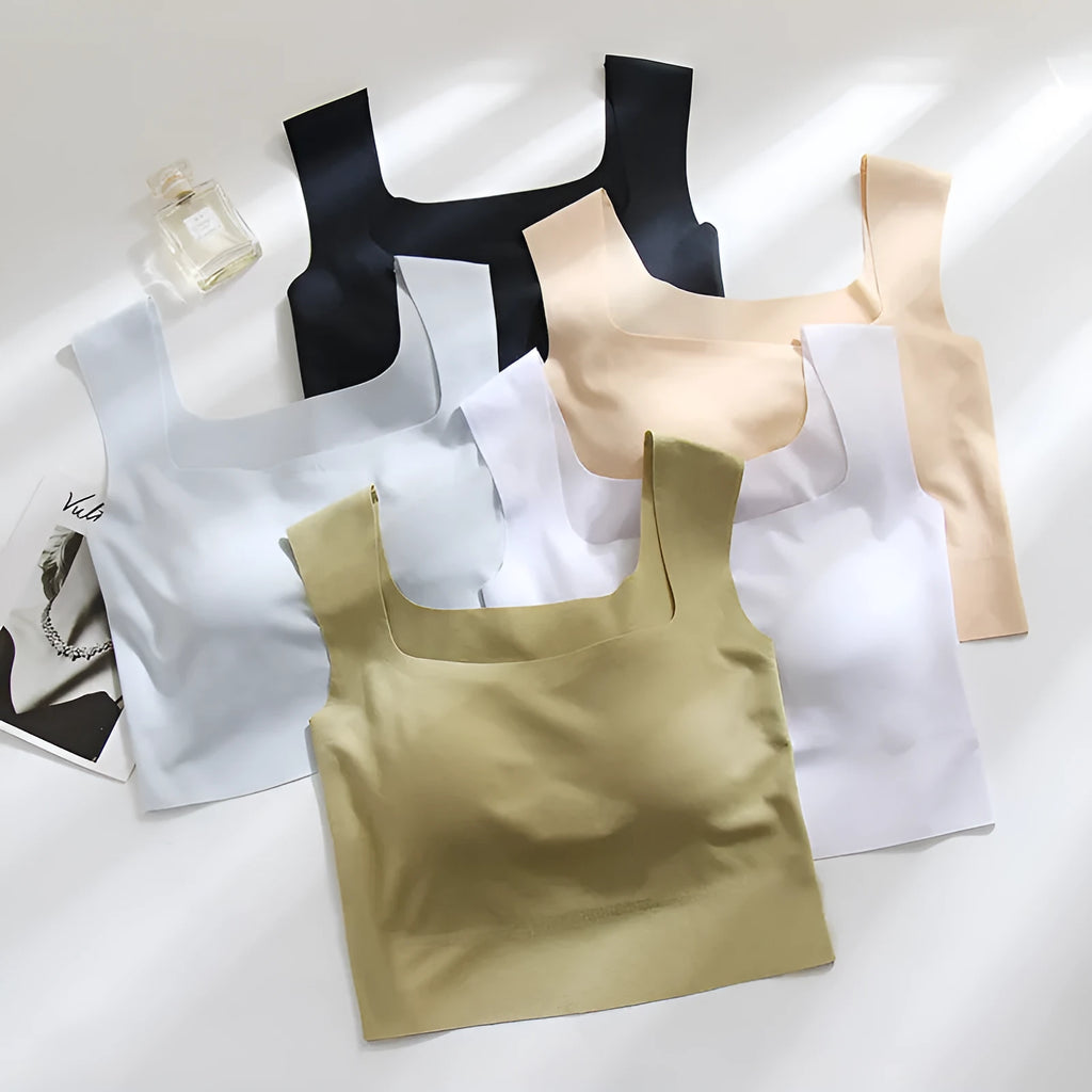 Women's white seamless sling vest with built-in fixation cup and chest pad, shown from the back.