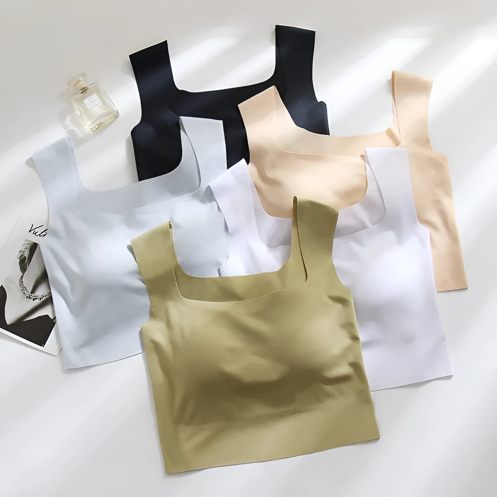 Women's white seamless sling vest with built-in fixation cup and chest pad, shown from the back.