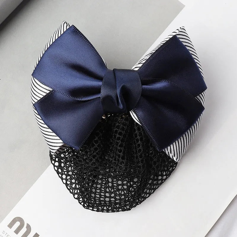 Professional hair clip with a black net pocket and a red flower bow ornament on a white background.