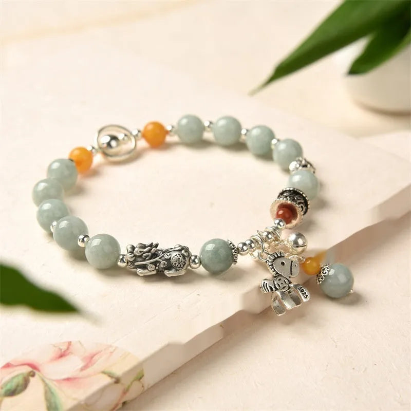 A vintage-style natural jade and alloy metal bracelet bangle for adults, showing retro pony style design.