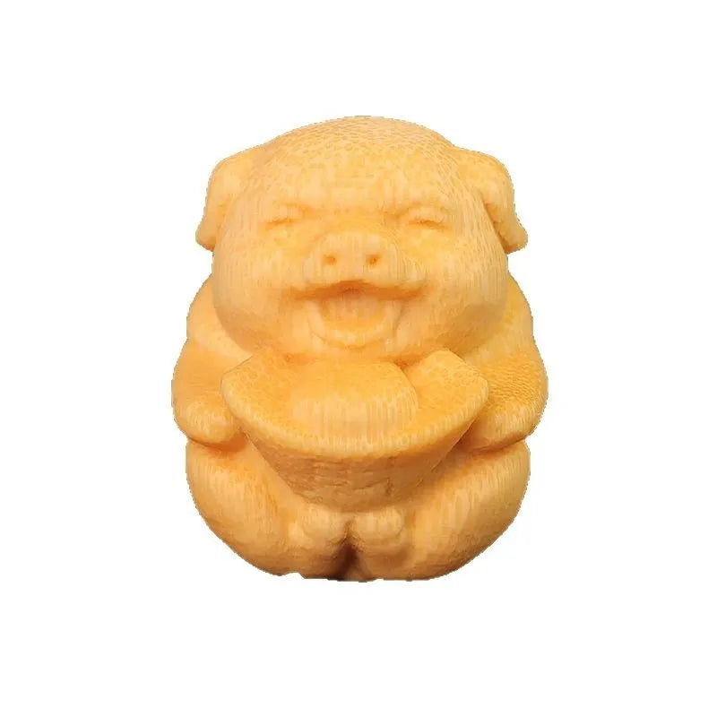 Solid bamboo carving ornament of an ingot pig, 4cm tall, on a wooden surface.