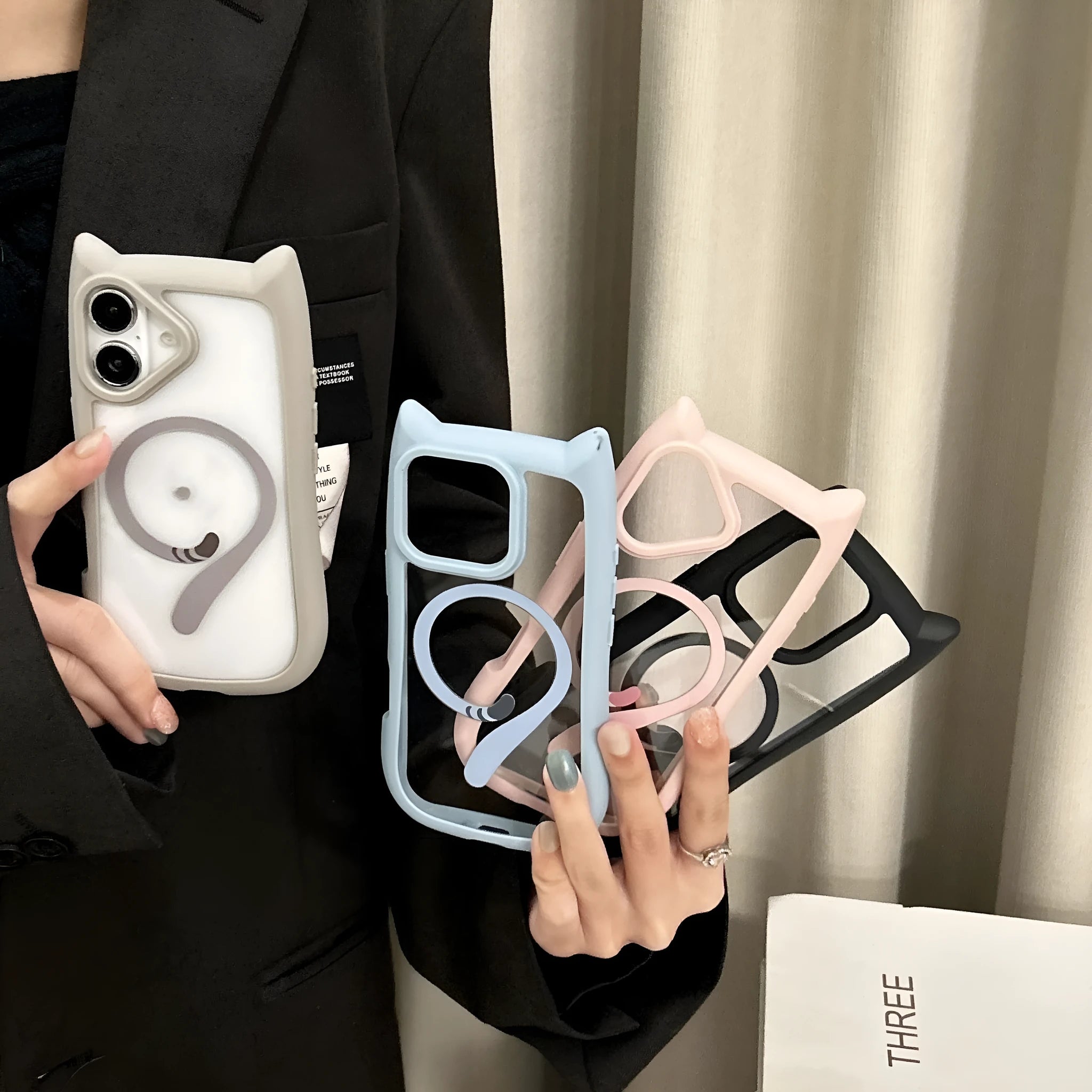 Clear acrylic and TPU two-layer phone case for iPhone 17 models on a table