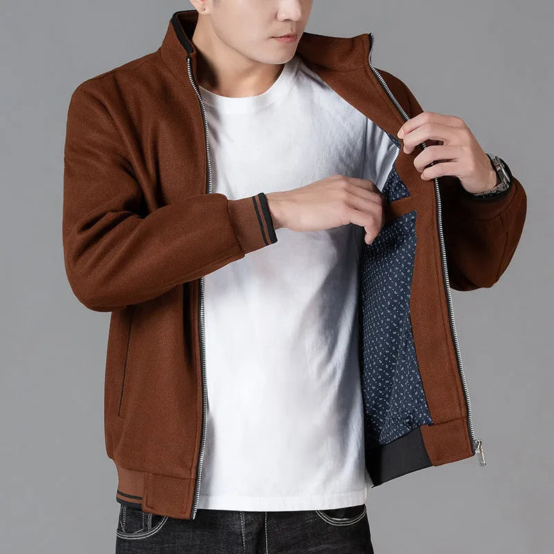 Men's grey sports-style fleece jacket with long sleeves and a stick pocket on the arm.
