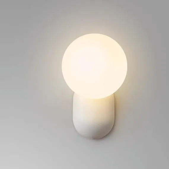 Nordic bedside wall lamp in black with acrylic shade and resin body