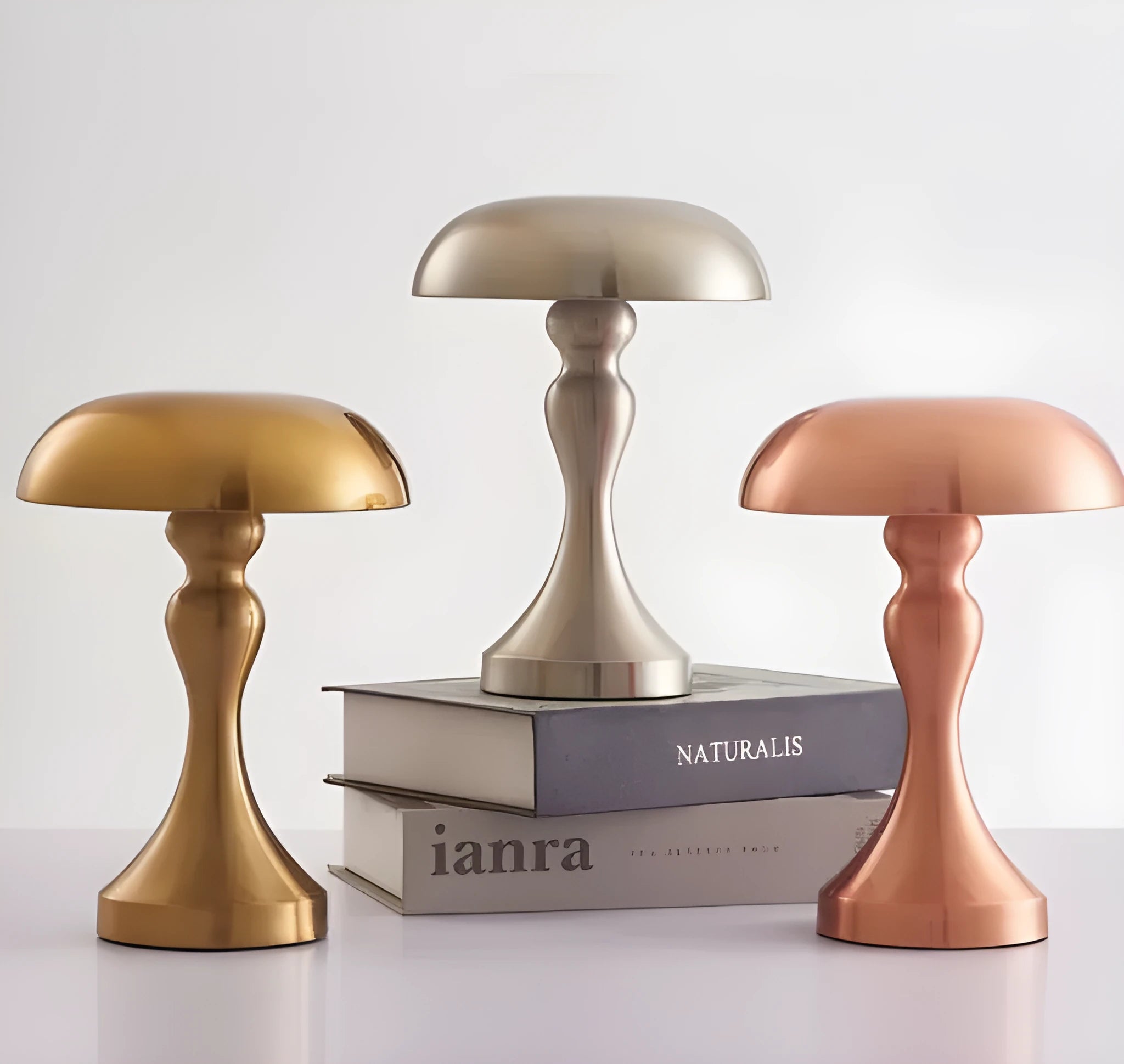 Bronze LED desk lamp with touch control showing three colour temperature settings on wooden desk