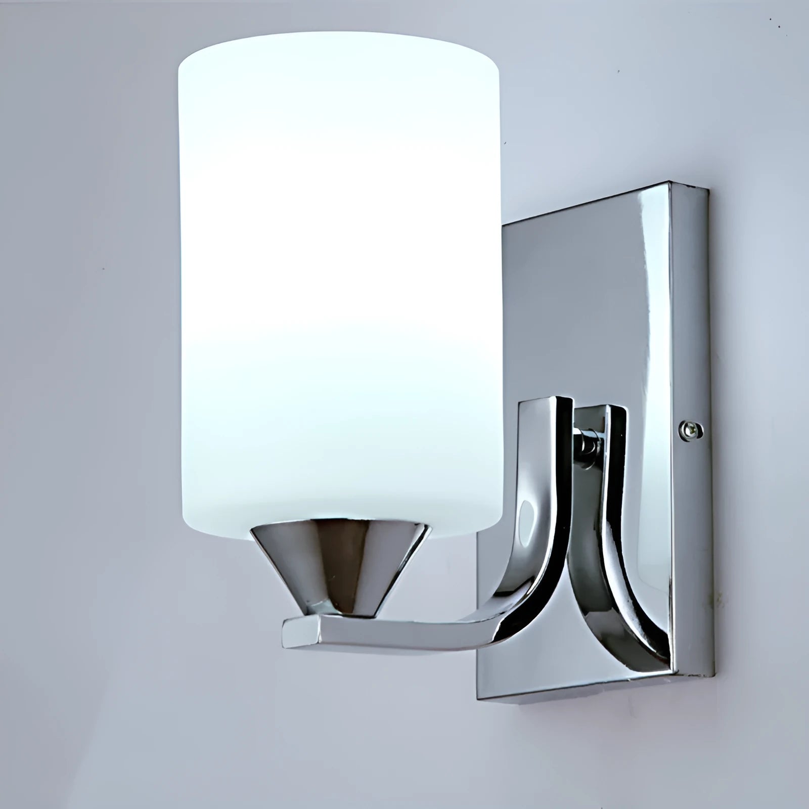 Modern chrome-finished wall lamp with a clear glass shade, shown in a single head configuration.