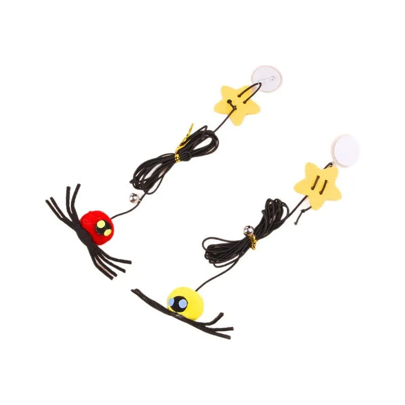 Red and yellow hanging cat toy with elastic rope, feather, bell, and spider elements for door mounting