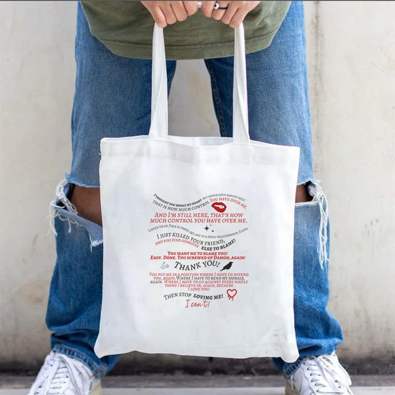 Women's canvas tote bag with printed letter pattern and chain detail in urban simplicity style