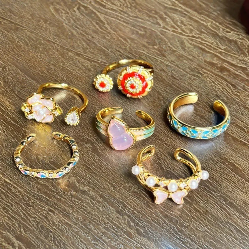 Adjustable vintage oil-dripping gourd copper ring with zircon inlay, showing flower shape in one of six colour options.