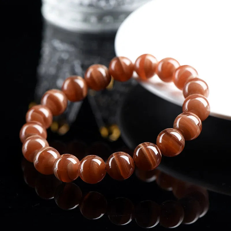 Natural old mine rhodochrosite round beads bracelet from Peru in 6mm or 8mm sizes with Ruyi elements