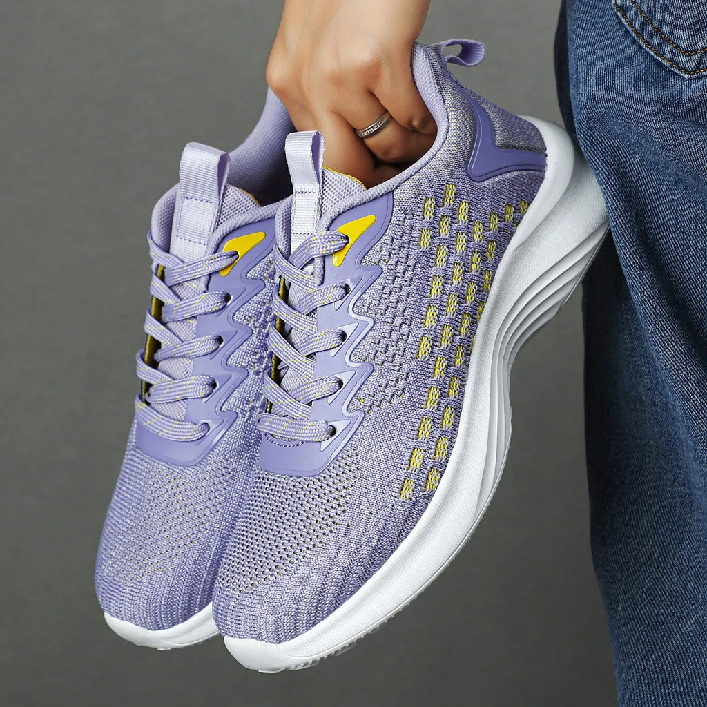 Women's lavender purple Flyknit running shoes with mesh fabric and striped pattern