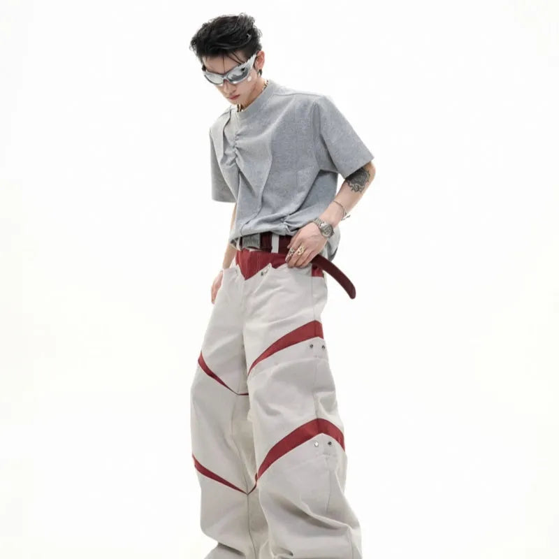 Men's grey cotton T-shirt with pleated detail on the front, showing a loose fit and round neck.
