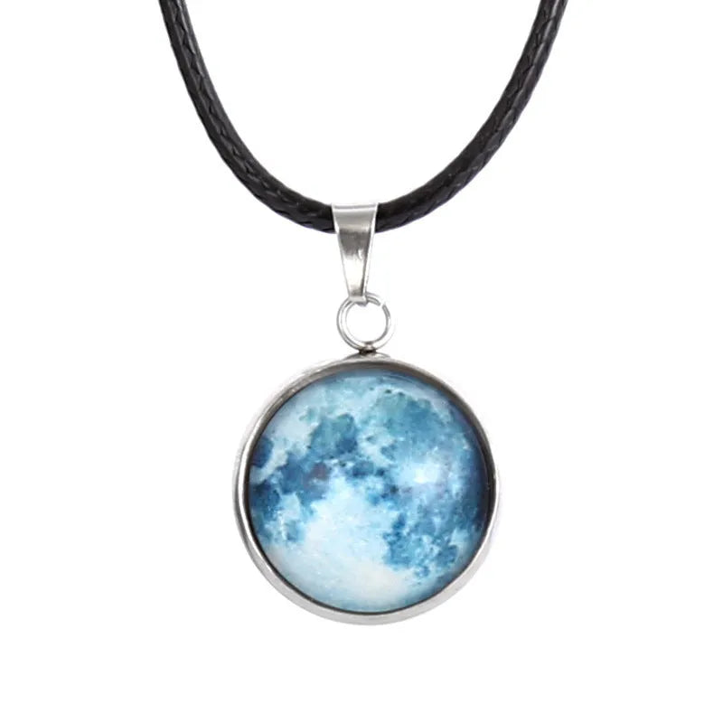 Luminous moon and constellation design pendant on an alloy necklace chain with extension.