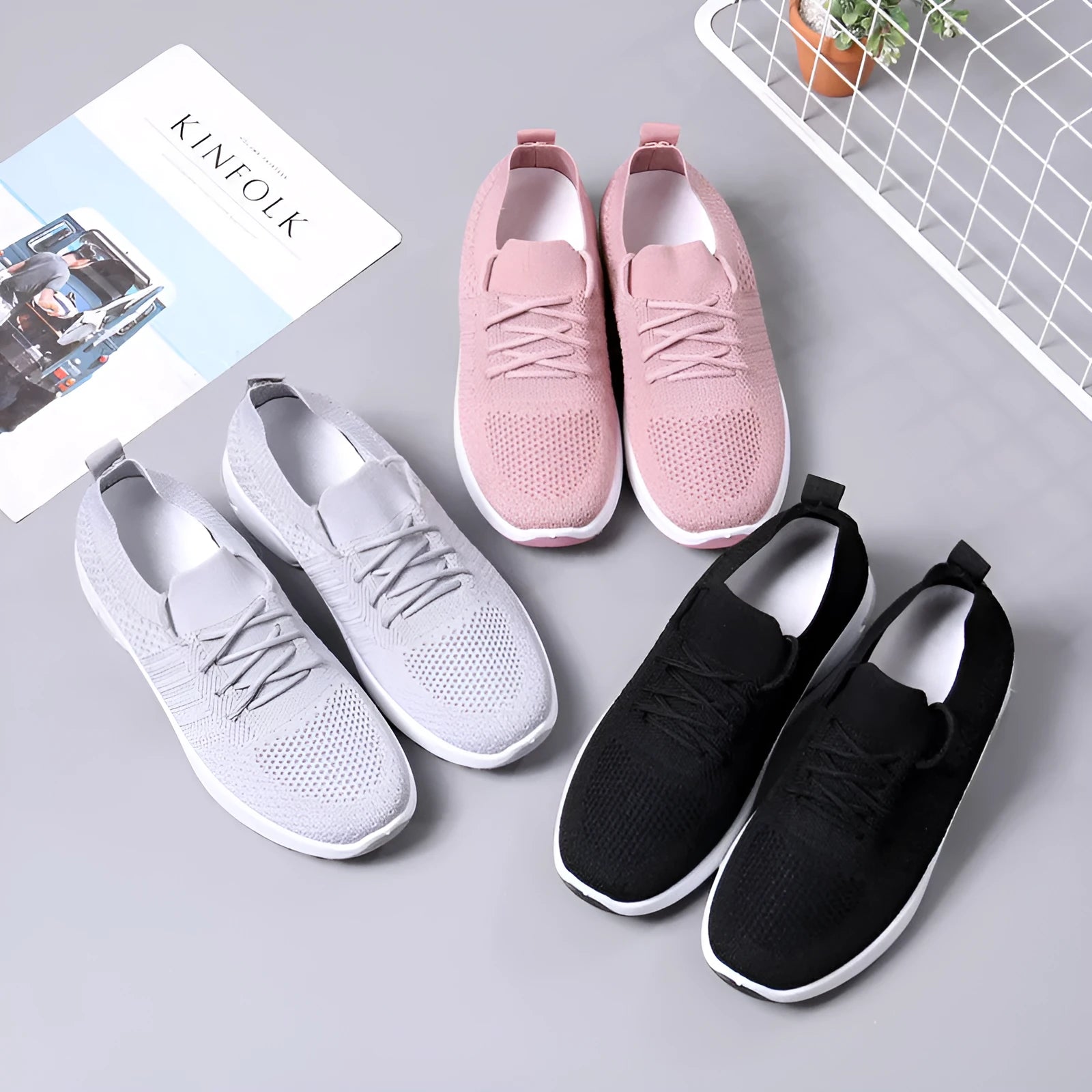 Women's black casual sneakers with mesh upper and non-slip PVC soles, shown with lace-up front closure
