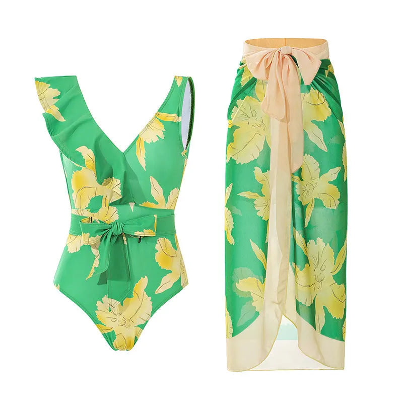 Women's solid colour one-piece swimsuit with spaghetti straps and a matching skirt.