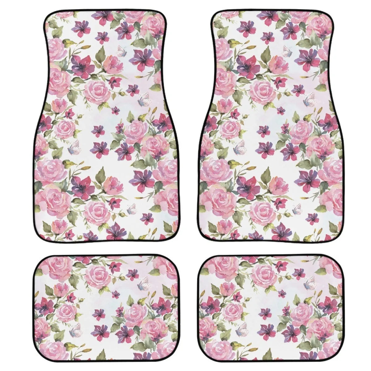 Four-piece set of thick black rubber car floor mats with printed patterns laid out for a vehicle.