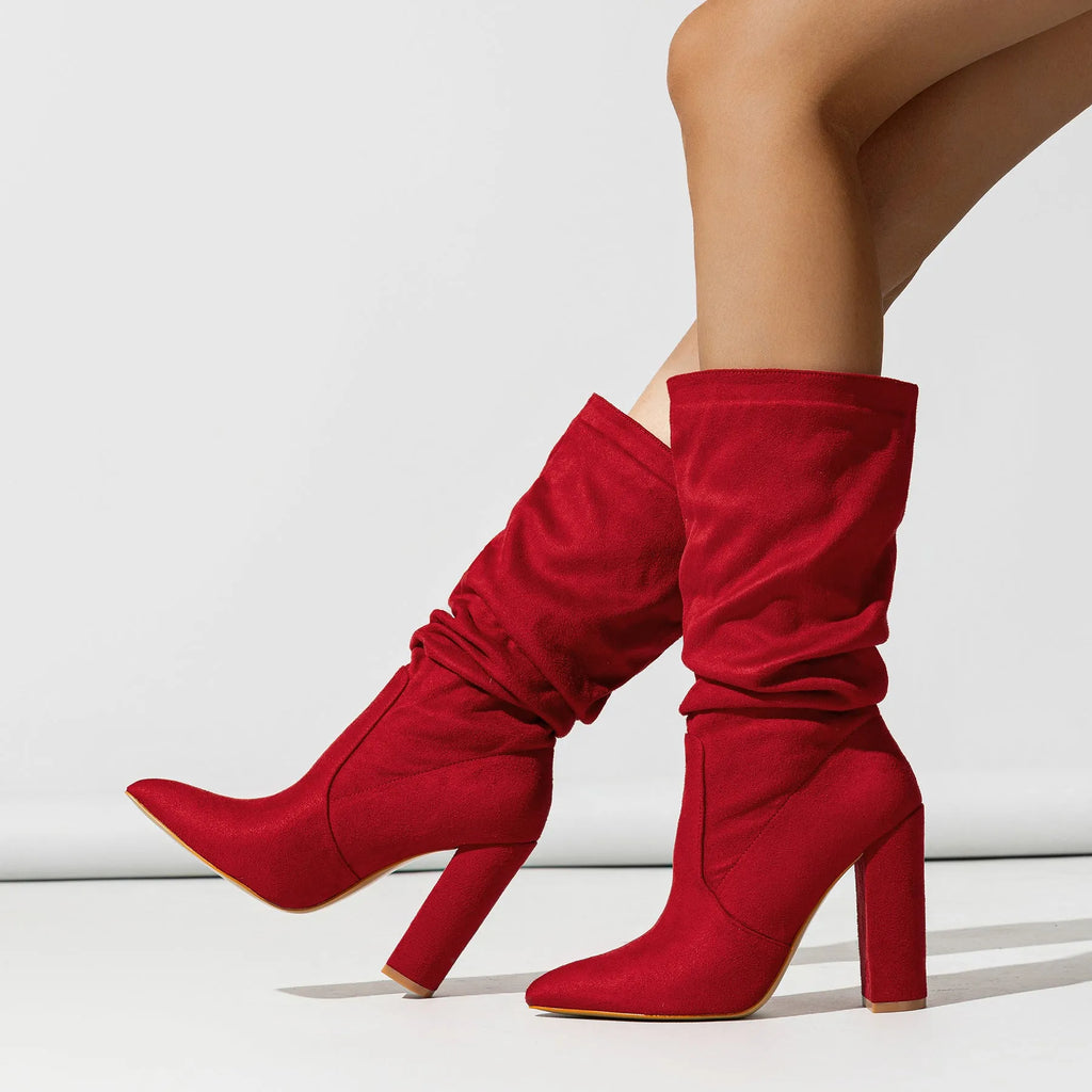 Women's black suede pointed-toe high heel boots with a chunky heel and middle calf length.