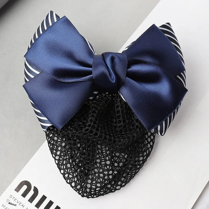 Professional hair clip with a black net pocket and a red flower bow ornament on a white background.