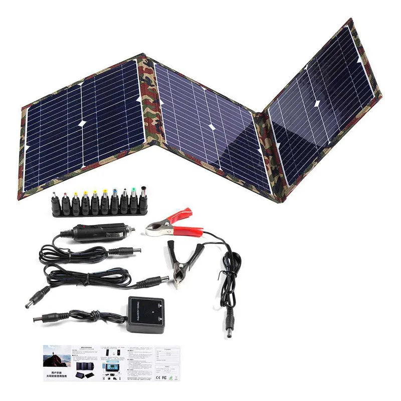 Black foldable 36W portable solar panel unfolded showing three solar cells, with car charger and cables.