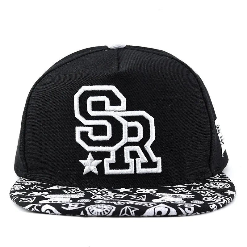 Cotton baseball cap with letter embroidery in black or white colours, showing adjustable strap and dome crown
