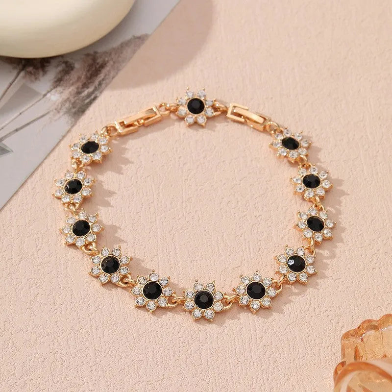 Floral-shaped zinc alloy bracelet with electroplated finish in gold and silver colour options.