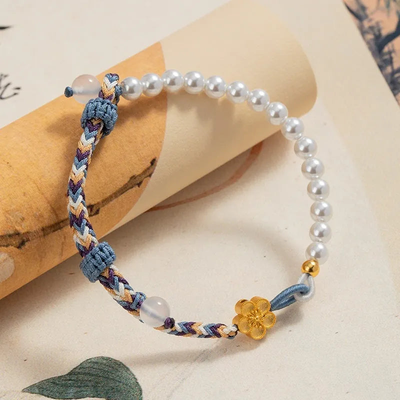 Colourful carrying strap bracelet with Chinese flower weaving and pearls in peach colour