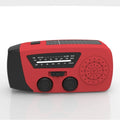 Red rechargeable emergency hand radio and LED torch with wrist strap on a white background