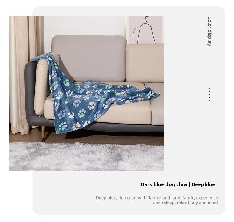 Blue cartoon dog pattern double-sided flannel pet blanket shown in a dog crate.