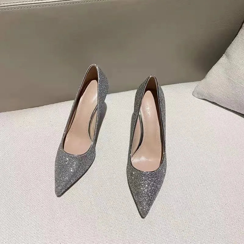 Silver and black women's stiletto bridal shoes with crystal decoration, showing different heel heights.