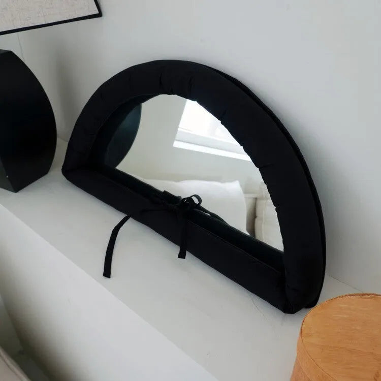 Soft cotton-filled fabric mirror in black, white or sapphire blue colour measuring 23x40cm