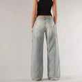 Women's blue cotton wide-leg mop trousers with low waist and splicing detail laid flat.