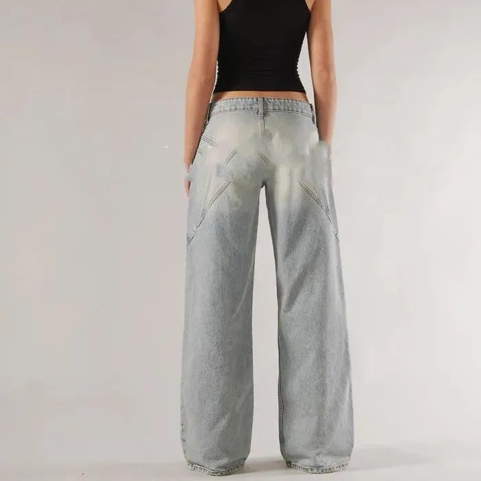 Women's blue cotton wide-leg mop trousers with low waist and splicing detail laid flat.