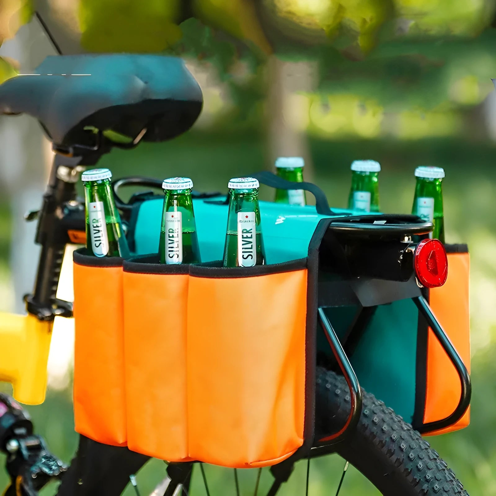 Black and orange double-sided bicycle drink holder bag made from 600D PVC fabric mounted on a bike frame.