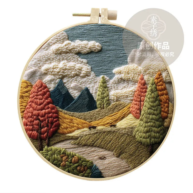 Embroidery DIY kit with printed landscape fabric, embroidery threads, needles, and frame for handmade cloth art