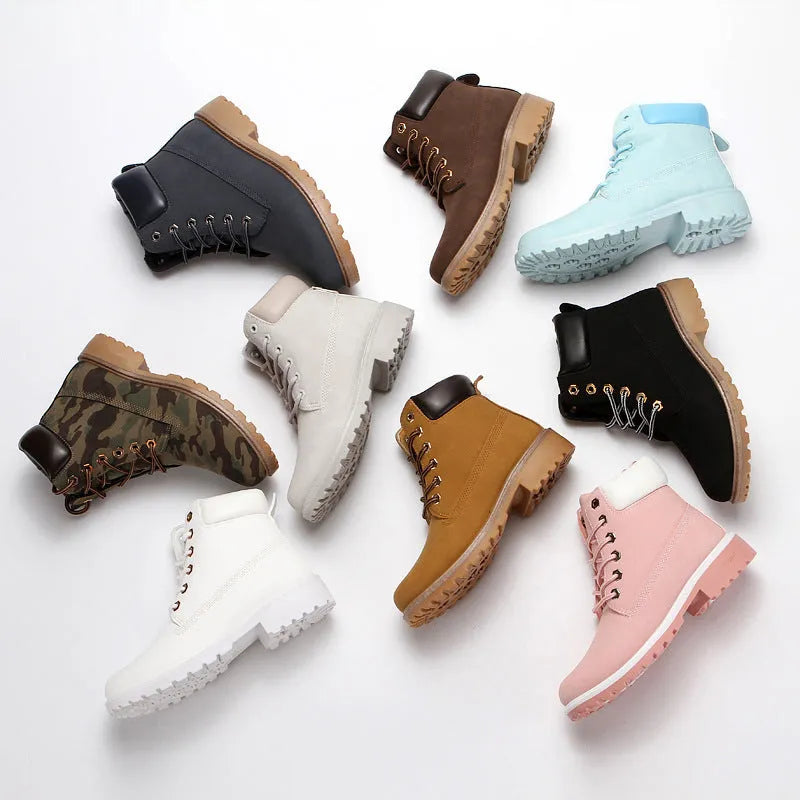 Men's pink high-top Martin boots with front lace-up and a low flat heel on a neutral background.