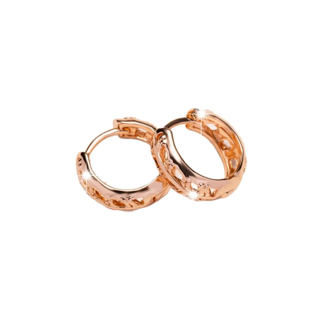 Copper rose gold hollowed-out leaf earrings with heart-shaped details