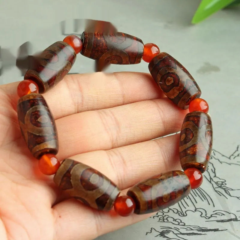 Agate Tibetan dzi bead bracelet with three-eye design and polished finish