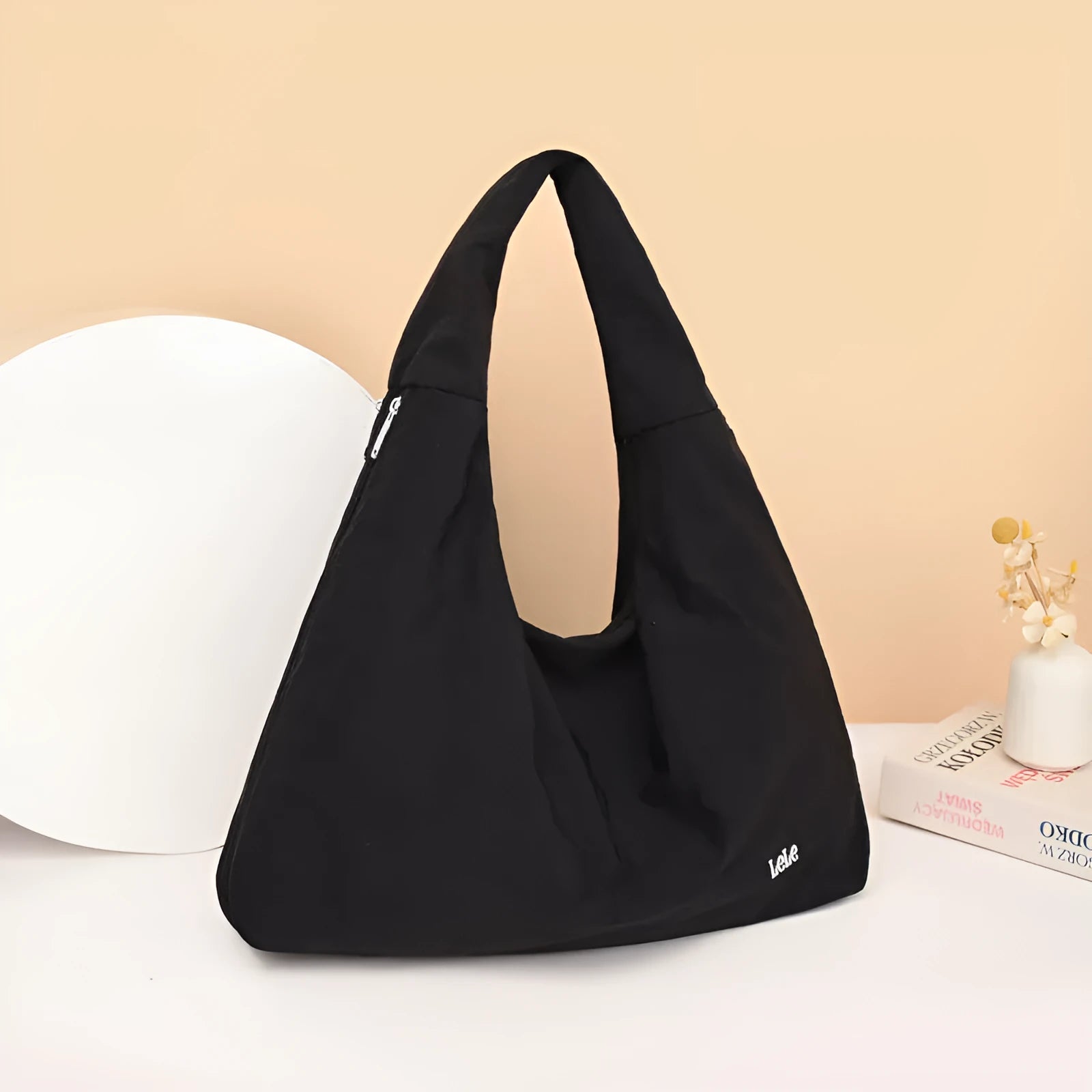 Soft nylon women's underarm bag in a heart shape, shown in black, blue, khaki, and yellow colour options.