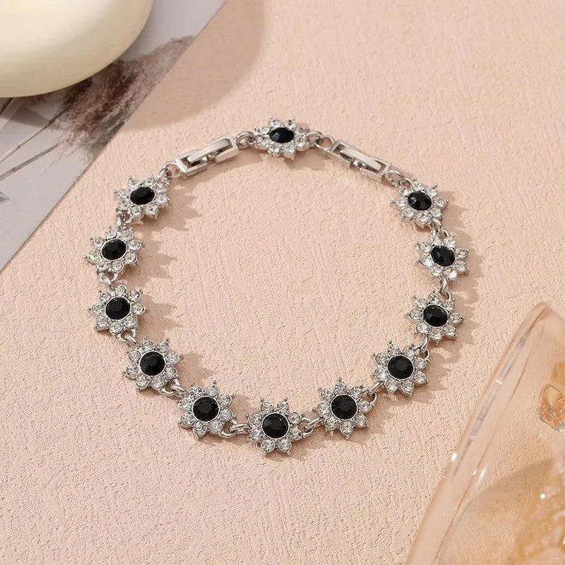 Floral-shaped zinc alloy bracelet with electroplated finish in gold and silver colour options.