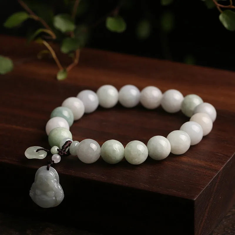 Emerald green jade bracelet with hanging symbolic charms including Maitreya Buddha design
