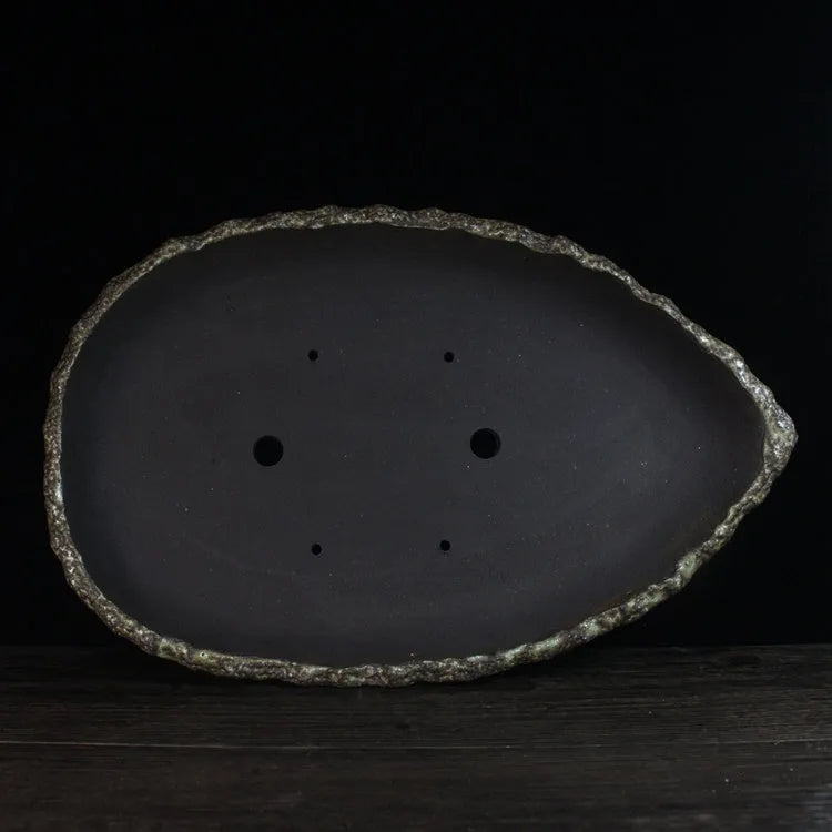 Handmade purple clay flower pot for floor-standing indoor plants in one of five decorative styles
