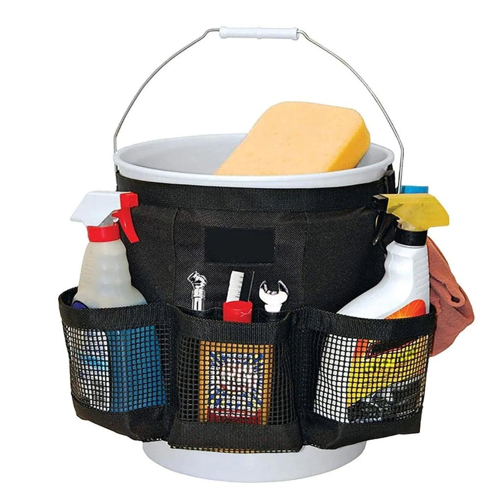 Black cylindrical polyester storage bag hanging on a 5-gallon barrel for outdoor tool organisation