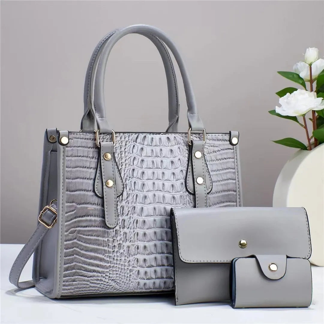 Contrast colour three-piece PU bag set showing crossbody bag, wallet, and card holder in burgundy.